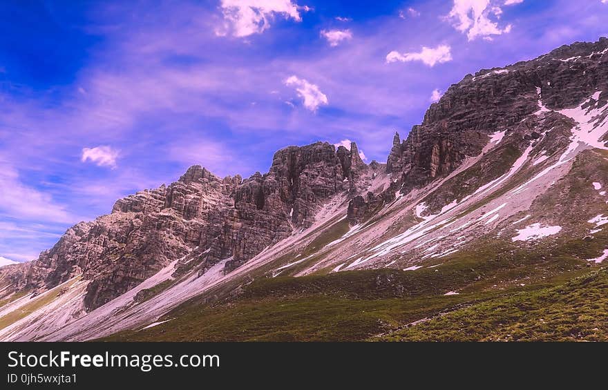 Gray Mountain Under Blue and White Cloudy Sky during Daytime