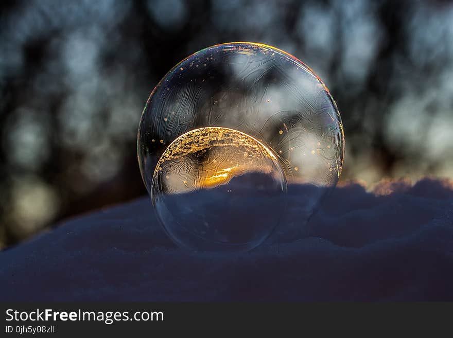 Close-up of Crystal Ball Against Blurred Background