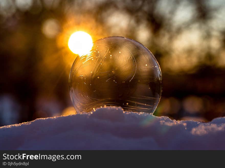 Defocused Image of Sun Reflecting in Water