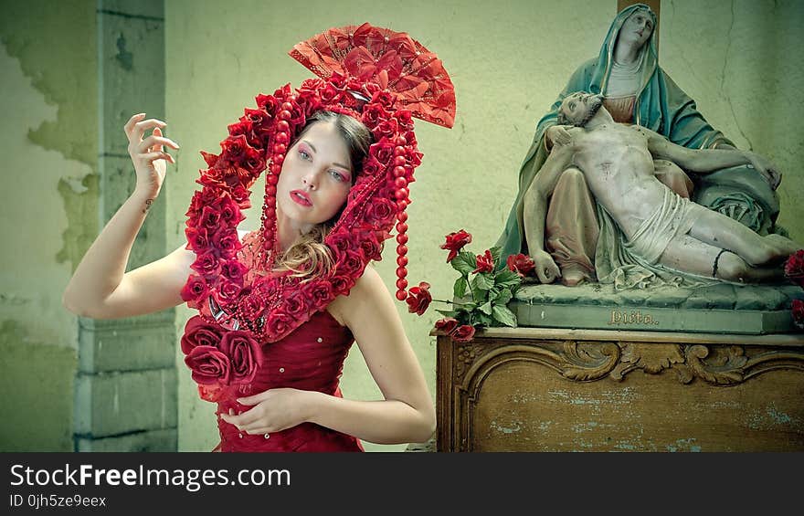 Midsection of Woman Wearing Red Flower