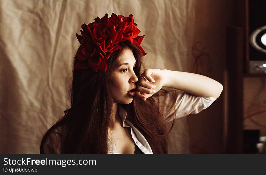 Photography of a Woman Wearing Red Flower Headdress