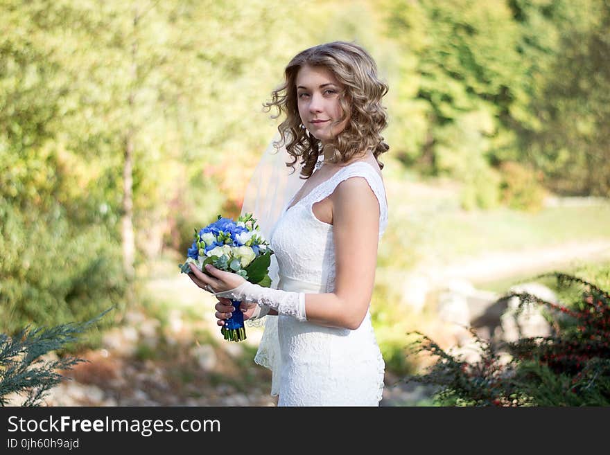 Portrait of a Beautiful Woman Holding Flower