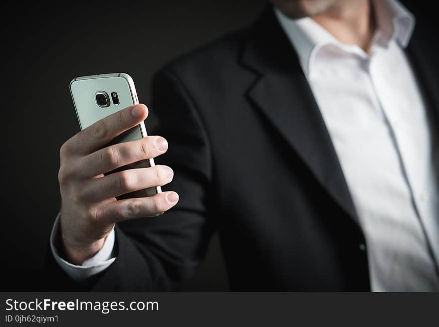 Close-up of Man Using Mobile Phone