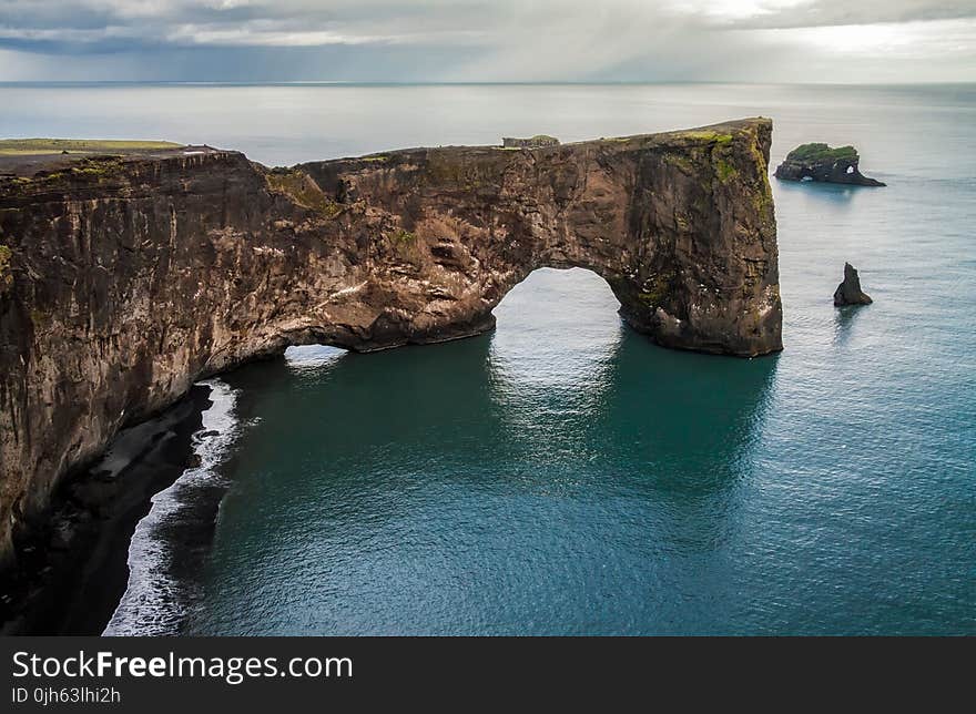 Scenic View of Cliff by Sea