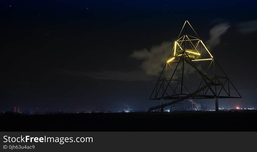 Light Trails in City Against Sky at Night