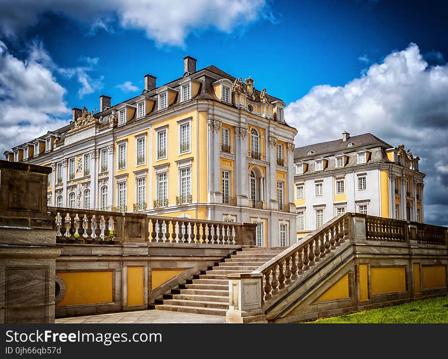 Statue of House in City Against Sky