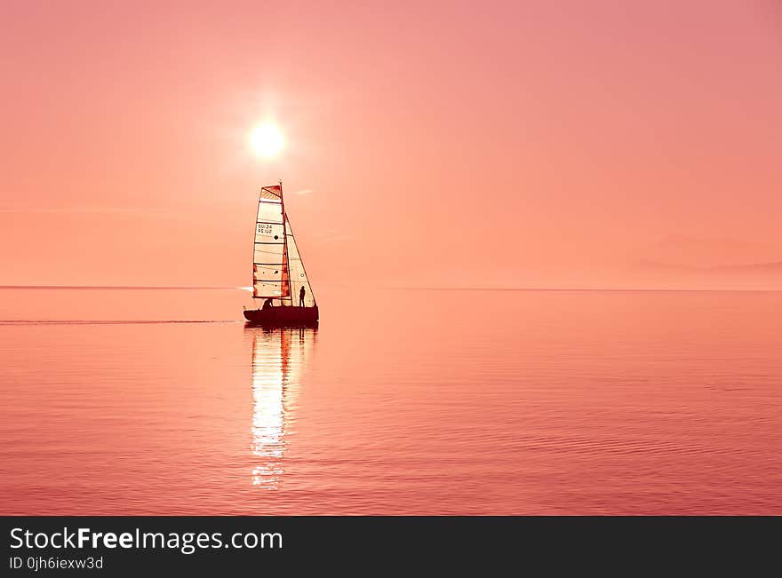 Boat on Body of Water during Sunset