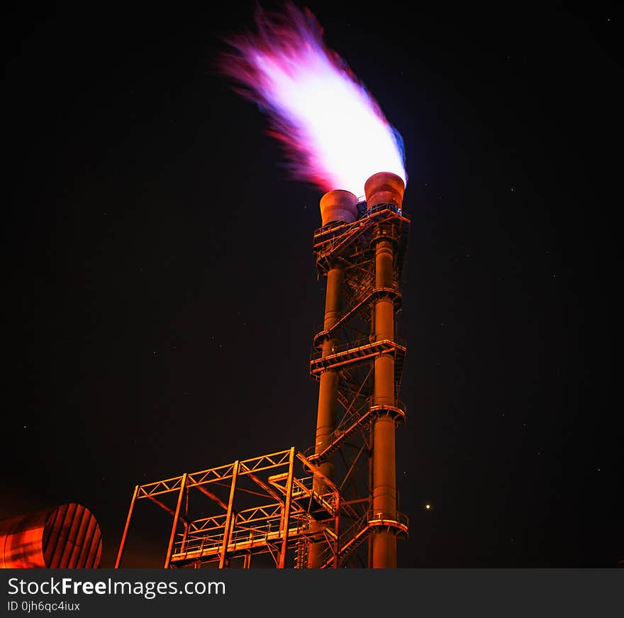 Low Angle View of Illuminated Tower Against Sky at Night