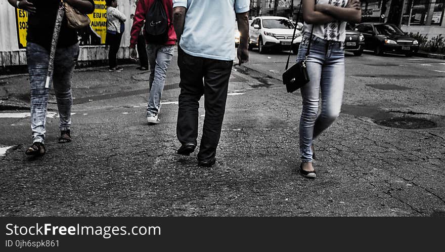 Person Wearing Black Denim Jeans and White Tops