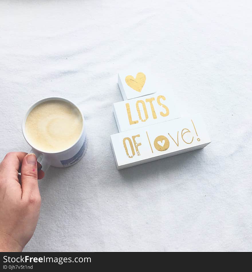 Person Holding White Ceramic Coffee Mug