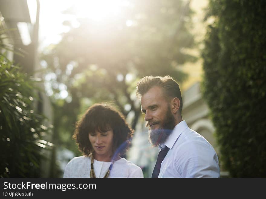 Photo of Couple Wearing White Shirts