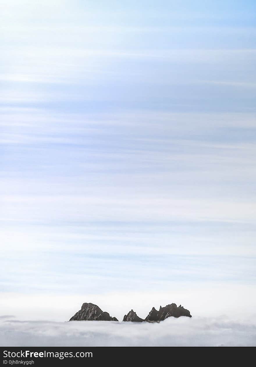 Silhouette of Inland Under Blue Sky at Daytime