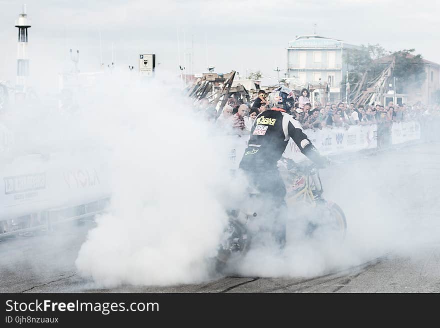 Man Riding Motorcycle With Smoke