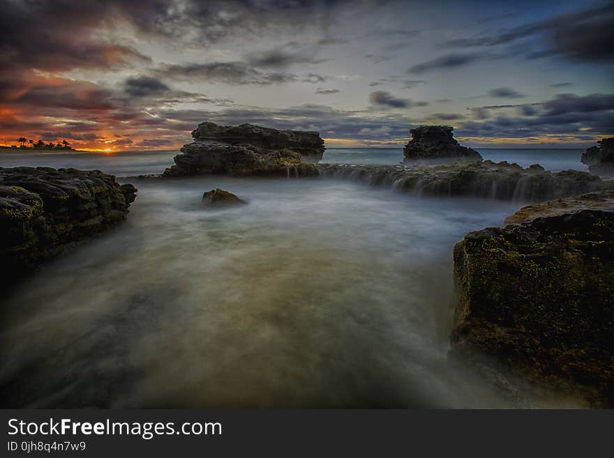 Scenic View of Ocean During Sunset