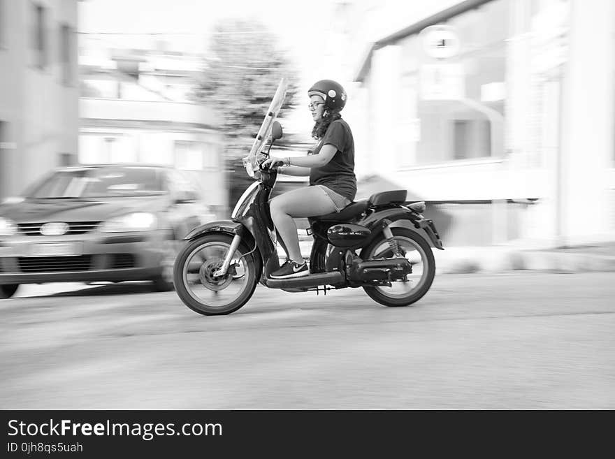 Woman Riding on Scooter Motorcycle