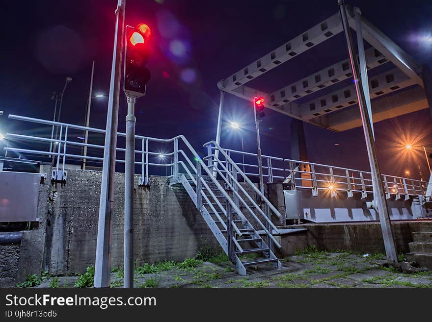 Gray Metal Stairs Near Road and Traffic Light