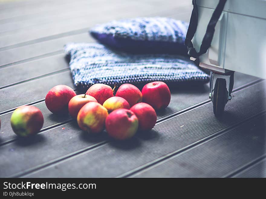 Red apples on the floor