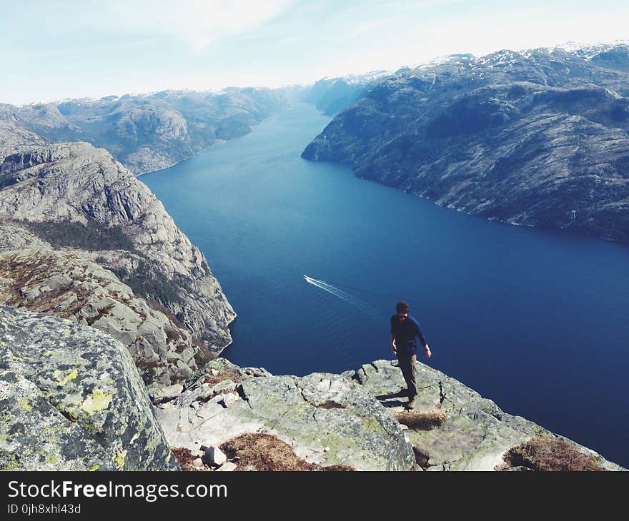 Man Standing on a Cliff