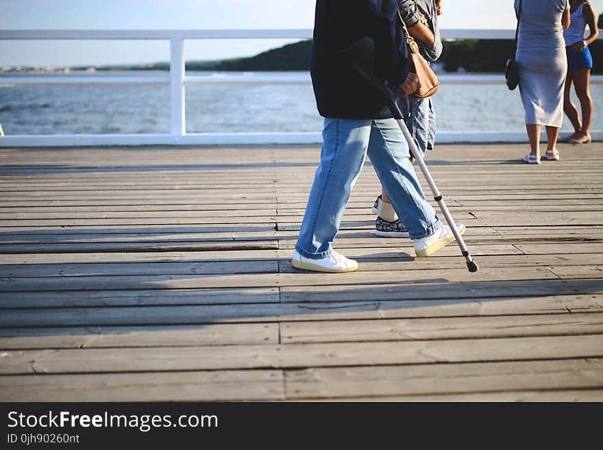 Woman with a crutch