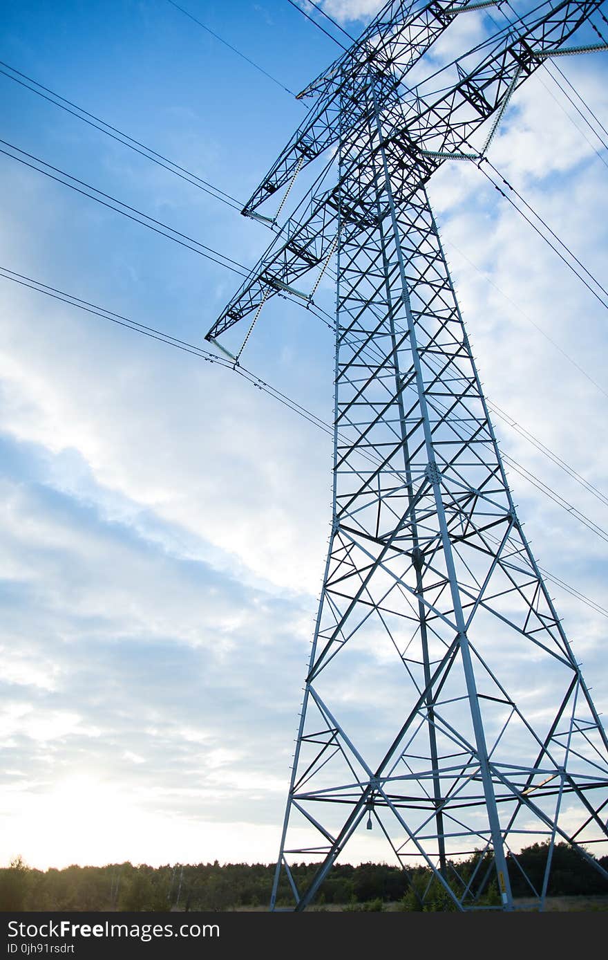 Gray Transmission Line Under Blue Sky at Daytime