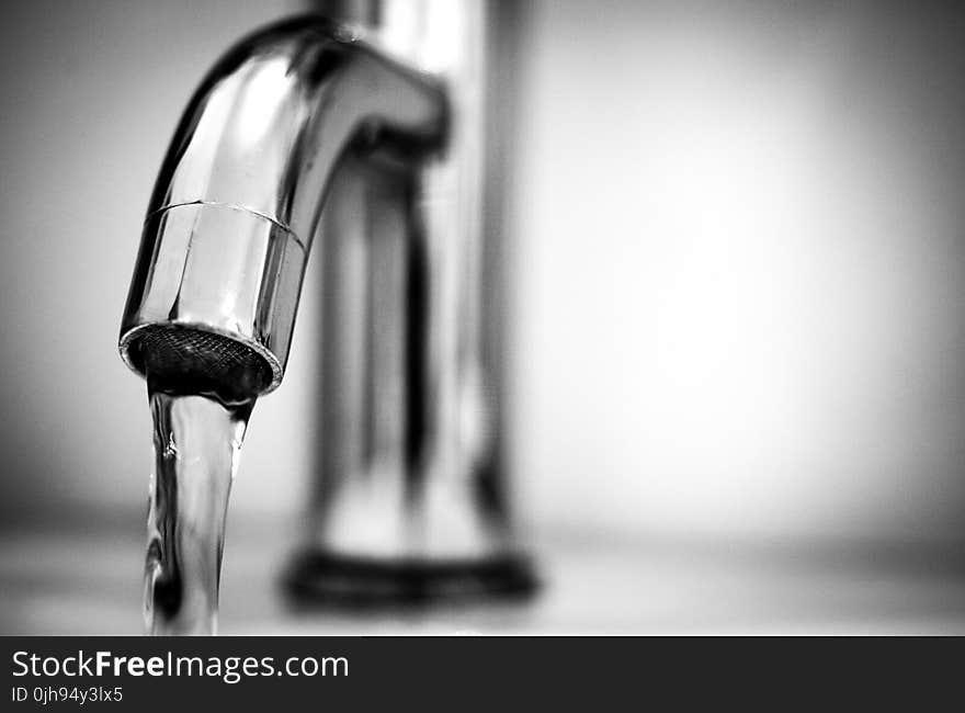 Macro Photography of a Stainless Steel Faucet