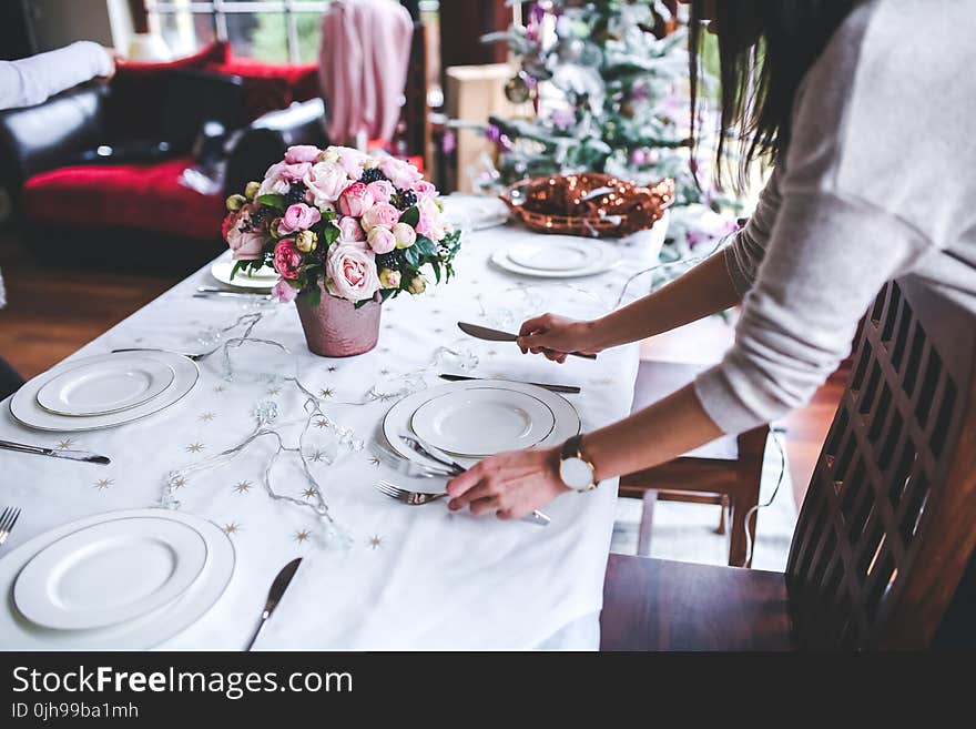 Woman Preparing Christmas Table