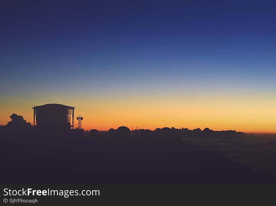 Silhouette of House After Sunset