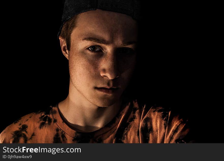 Man Wearing Brown and Black Crew-neck Shirt