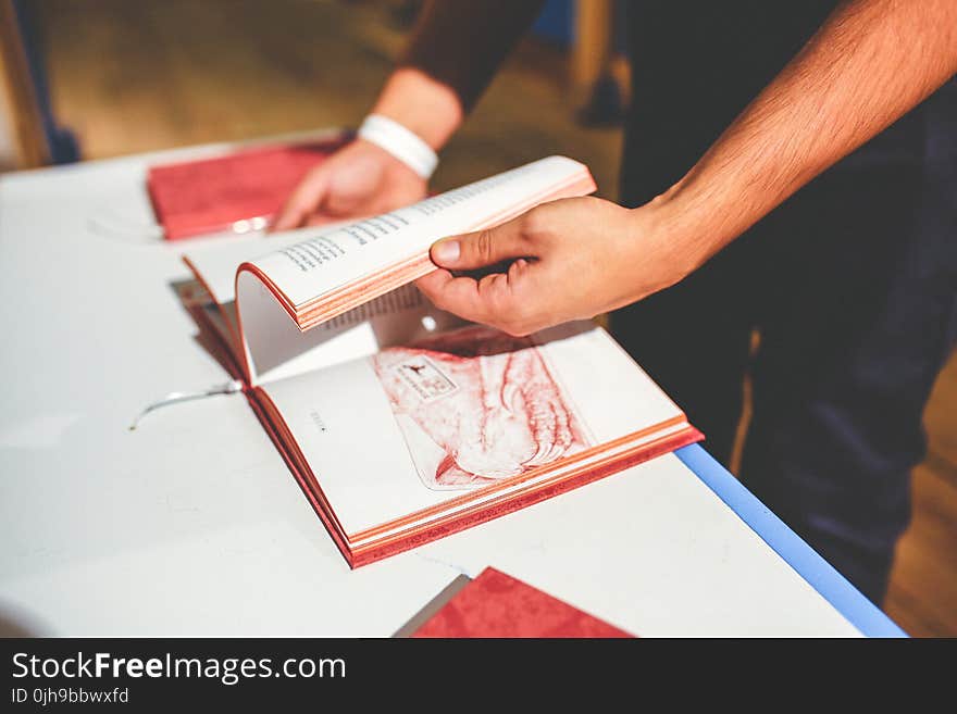 Book in men&#x27;s hands