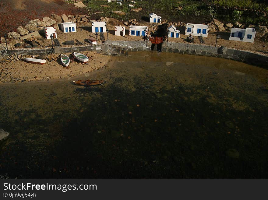 Aerial Photo of Boats Beside Body of Water