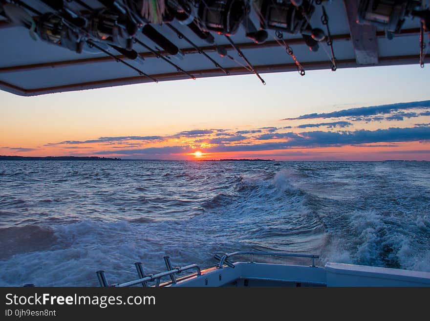 Wide Angle Photo Of Body Of Water During Sunset