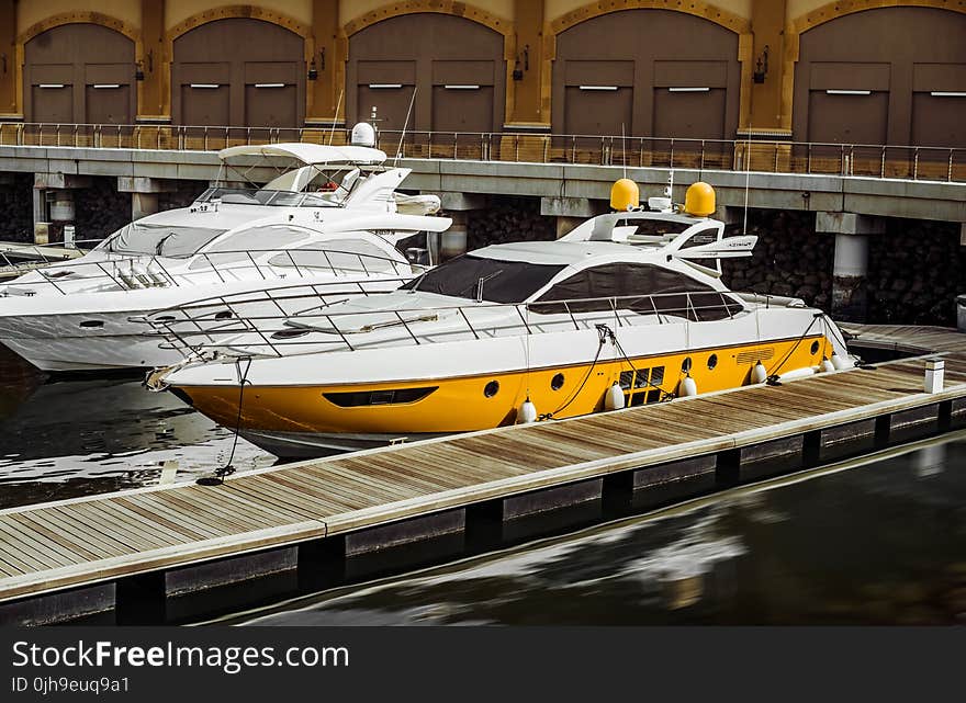 Photography of Two White Yacht on Body of Water