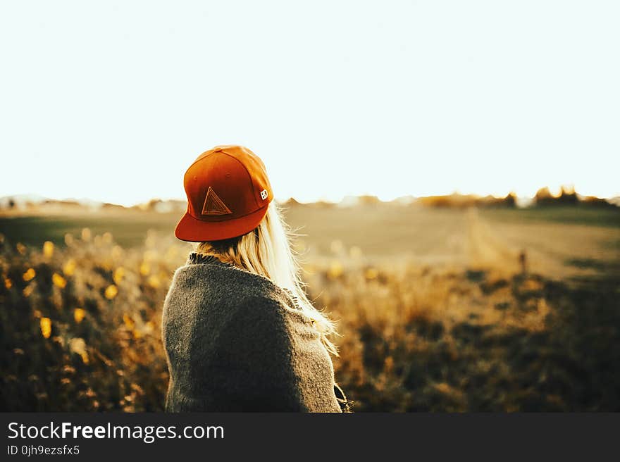 Woman Wearing Gray Shirt With Cap Under White Sky