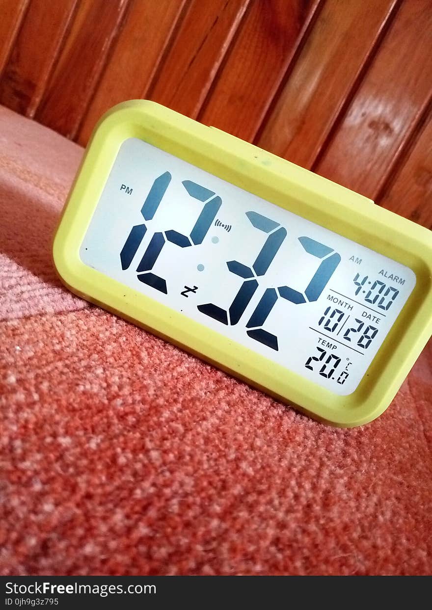 Close-Up Photography of Yellow Alarm Clock