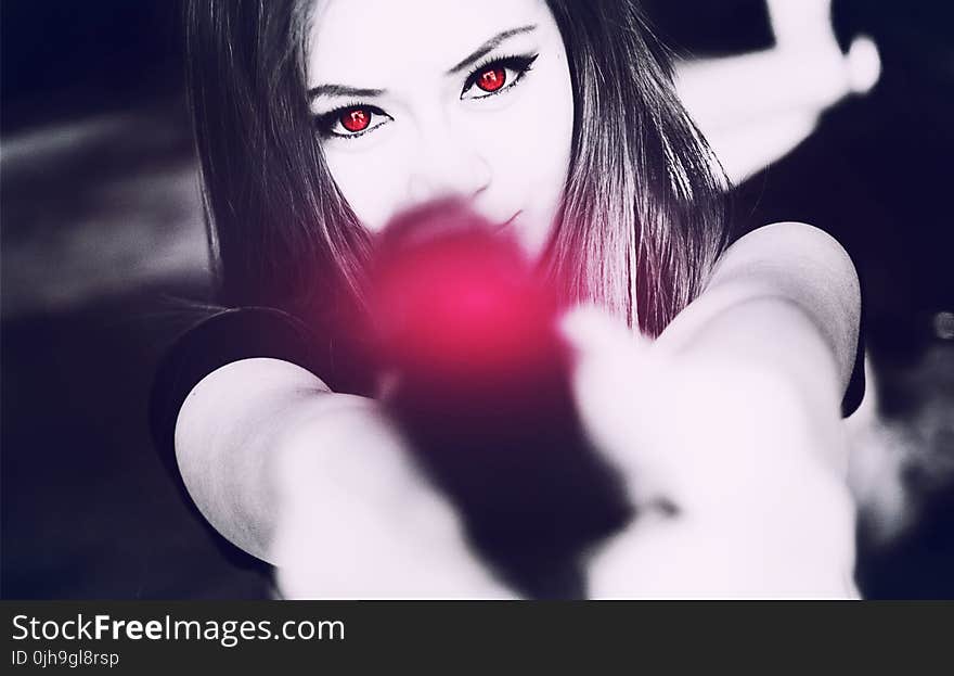 Black and White Photography of Woman Holding Pistol