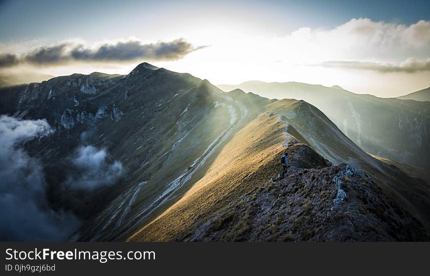 Mountain Under Cloudy Sky With Sunlight