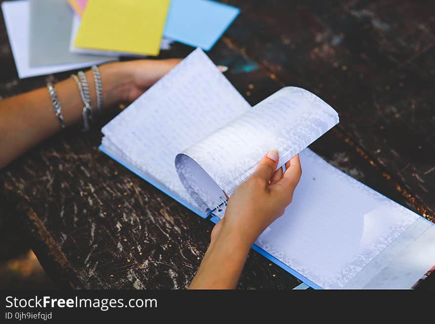 Notebook in hands