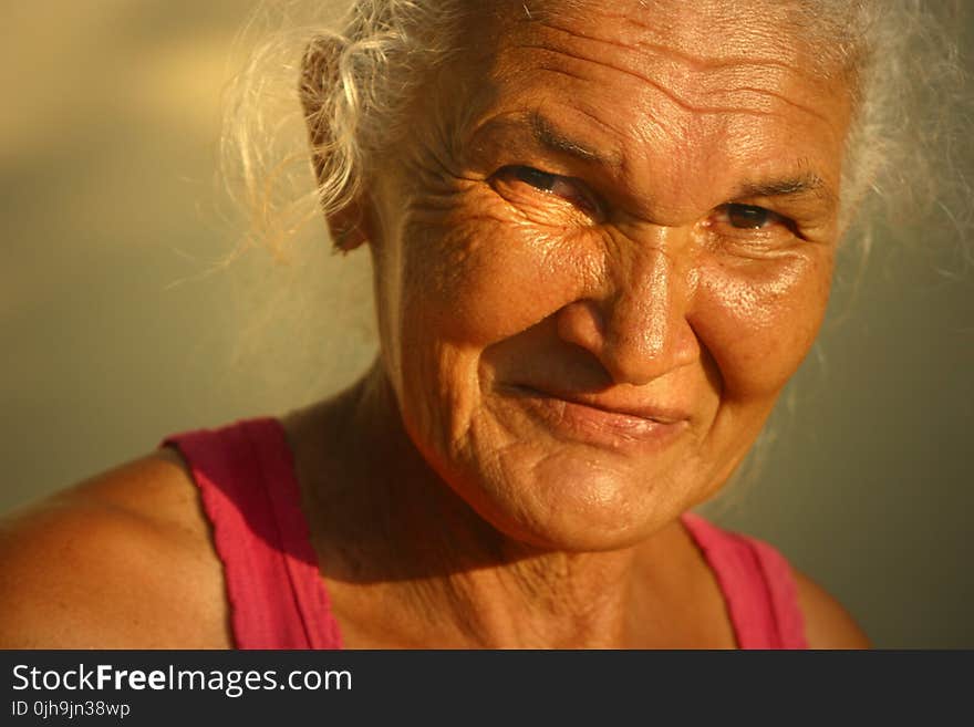 Woman In Red Tank Top Smiling