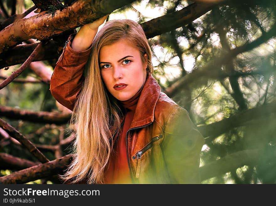 Woman Wearing Brown Leather Zippered Jacket