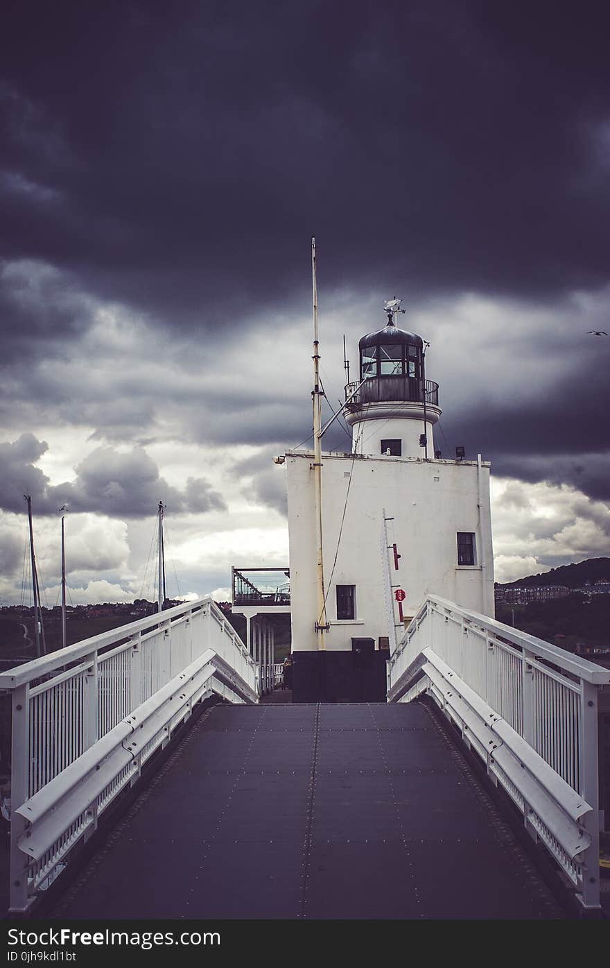 View of Cloudy Skies on Lighthouse