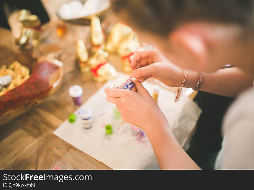 Close up of girl hands coloring eggs for easter II