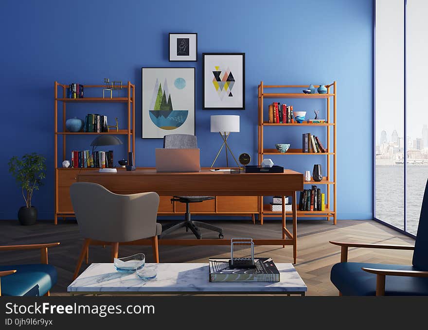 Brown Wooden Desk With Rolling Chair and Shelves Near Window