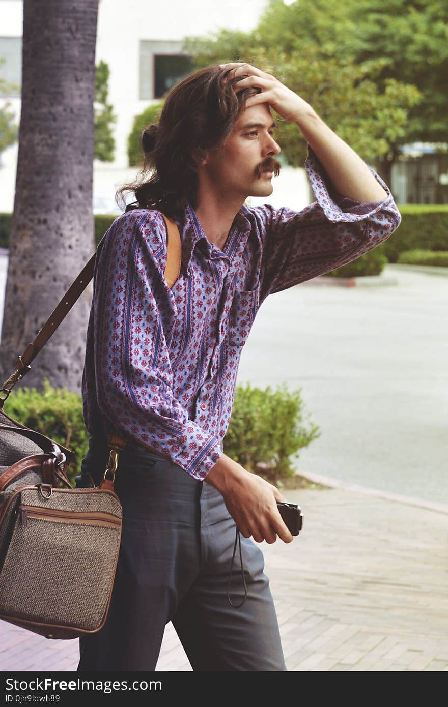 Man in Blue Button-up Long-sleeve Shirt