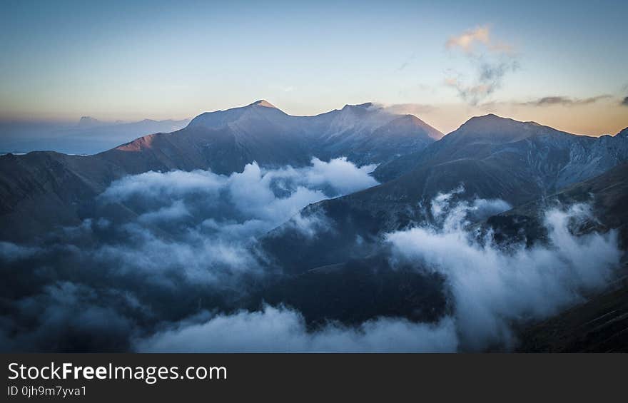 Photography of Mountain With Blue Sky As Backgroundw