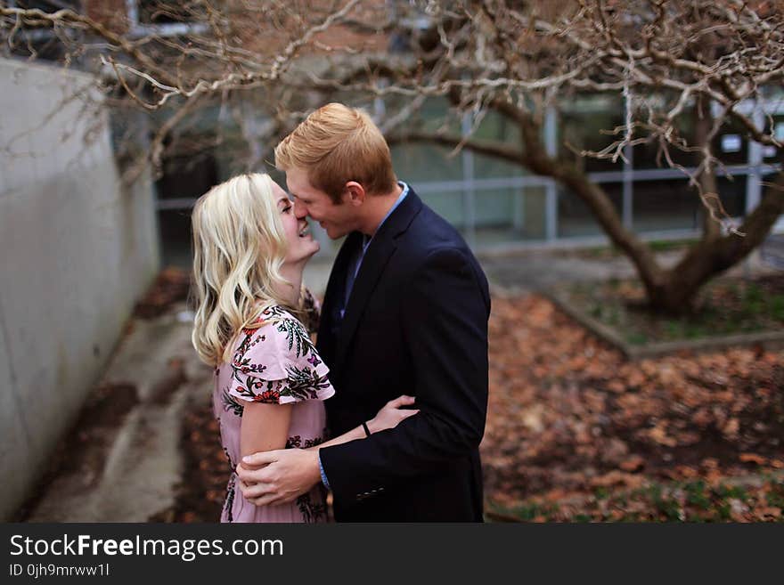 Smiling Couple Standing Near Bare Tree Outdoors Macro Shot