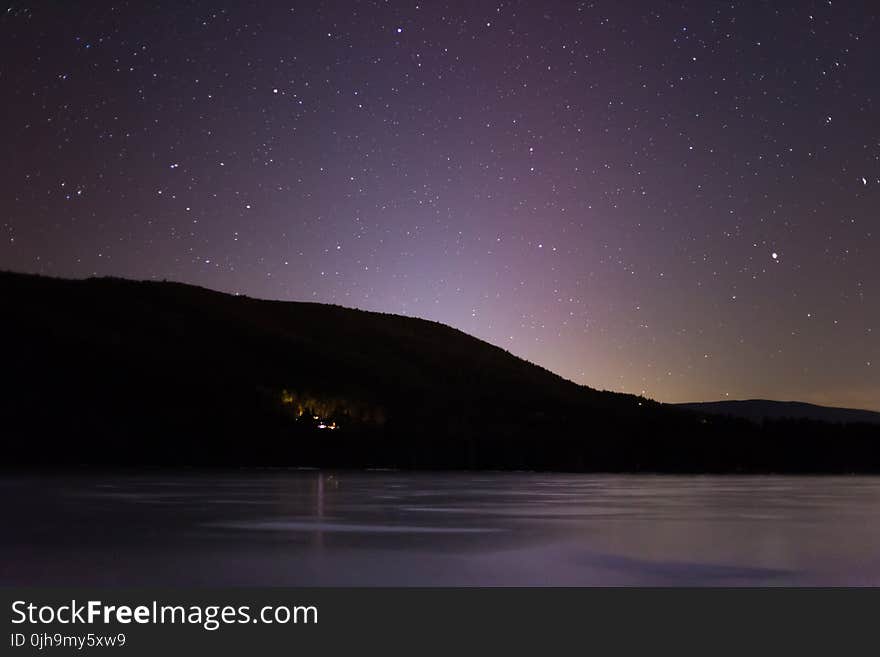 Dark Photography of Mountain and Galaxy