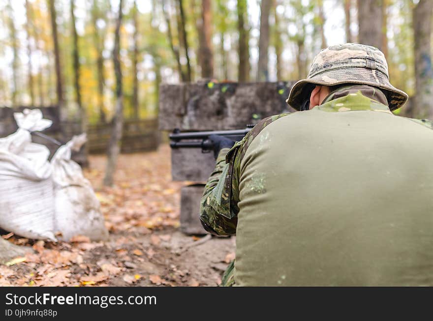 Man Holding Rifle