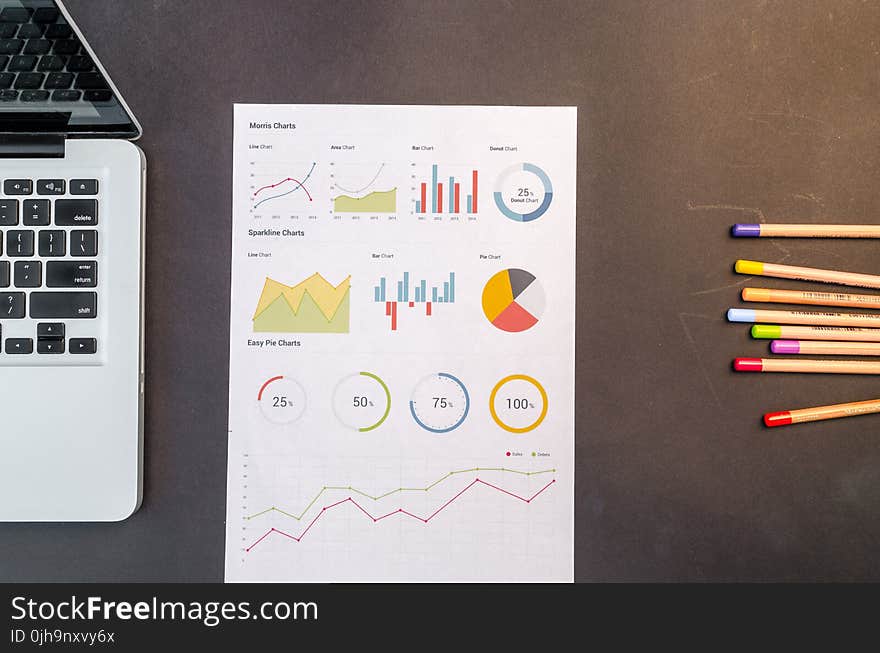 Charts On Black Wooden Table