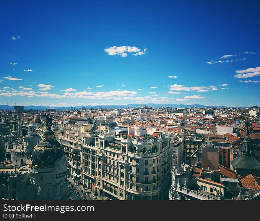 Architectural Photography Of Metropolis Under Stratus Clouds