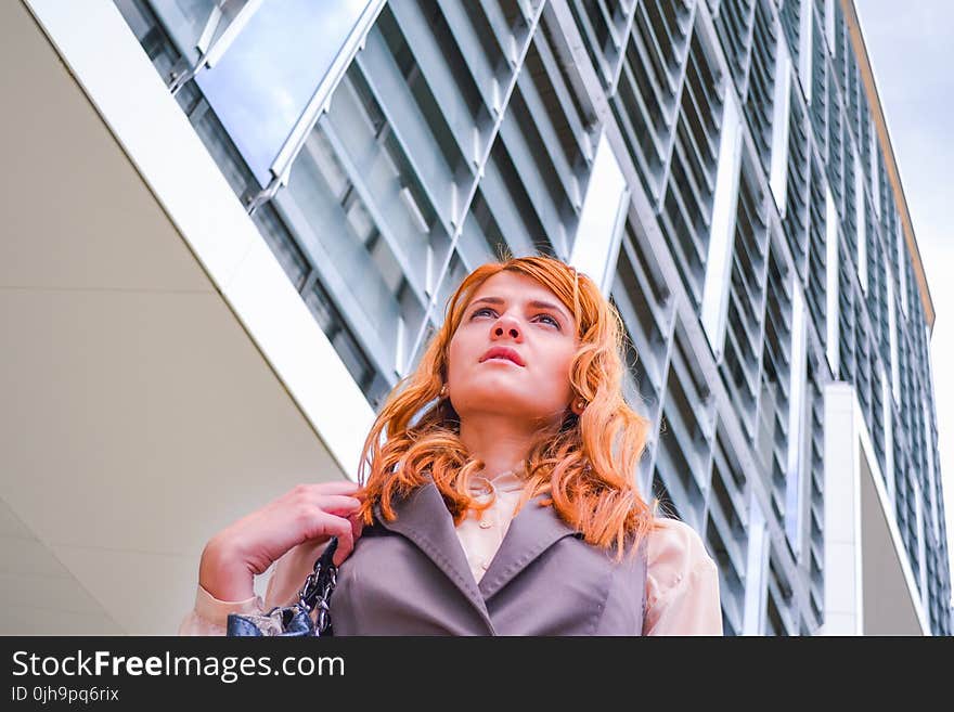 Woman in Grey Blazer Low Angle Photography Near Building